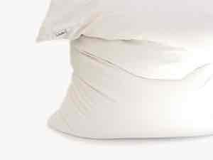 Buckwheat pillow on end slumped over illustrating beanbag-like quality