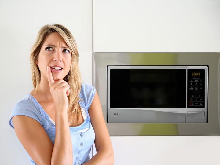 Woman contemplates microwaving things