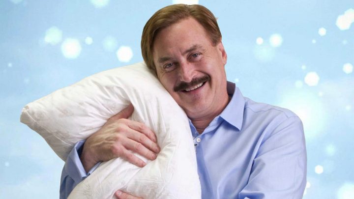 Michael J. Lindell hugs a My Pillow